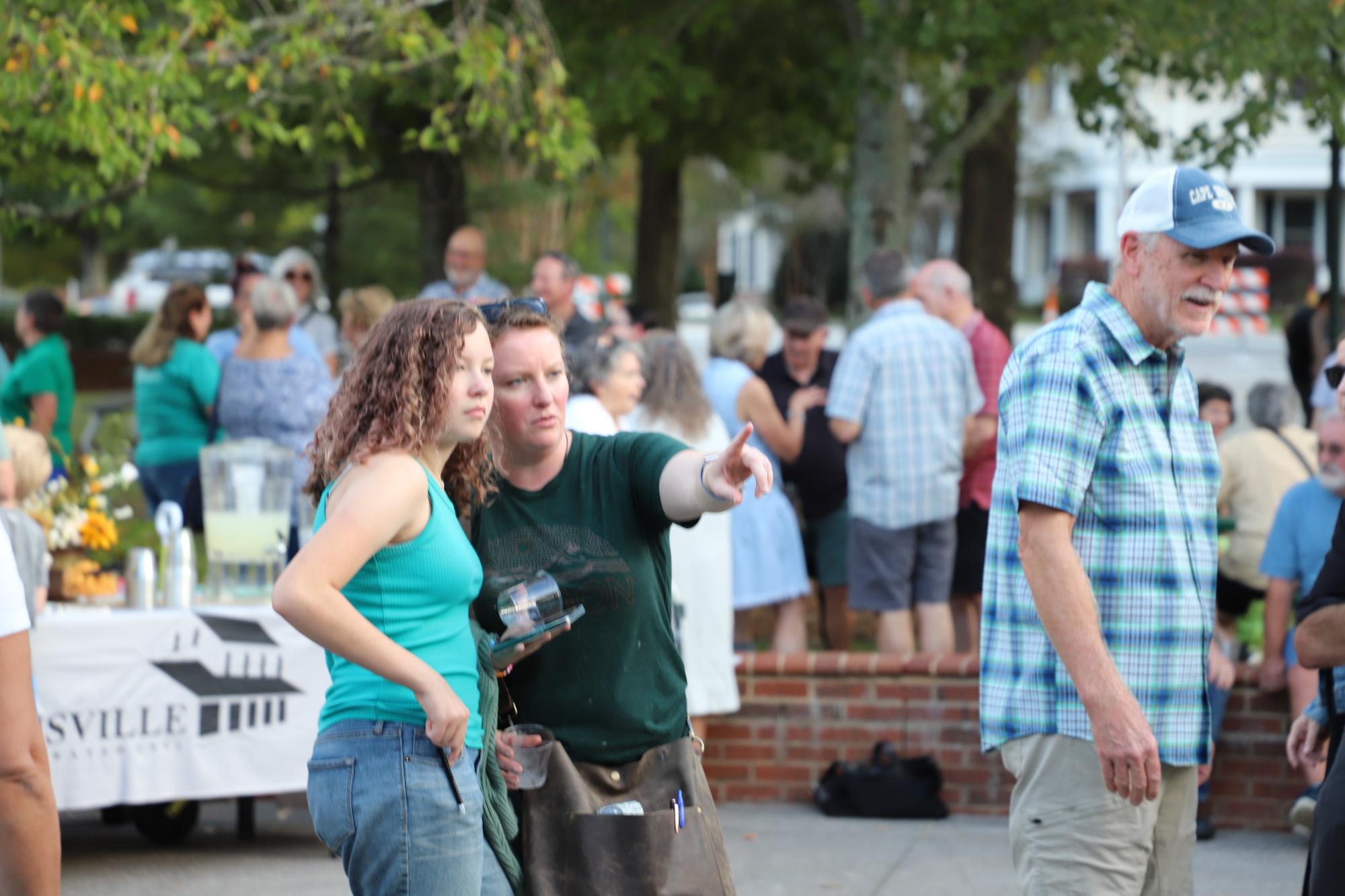Attendees admire the newly installed sculpture at Shallowford Square