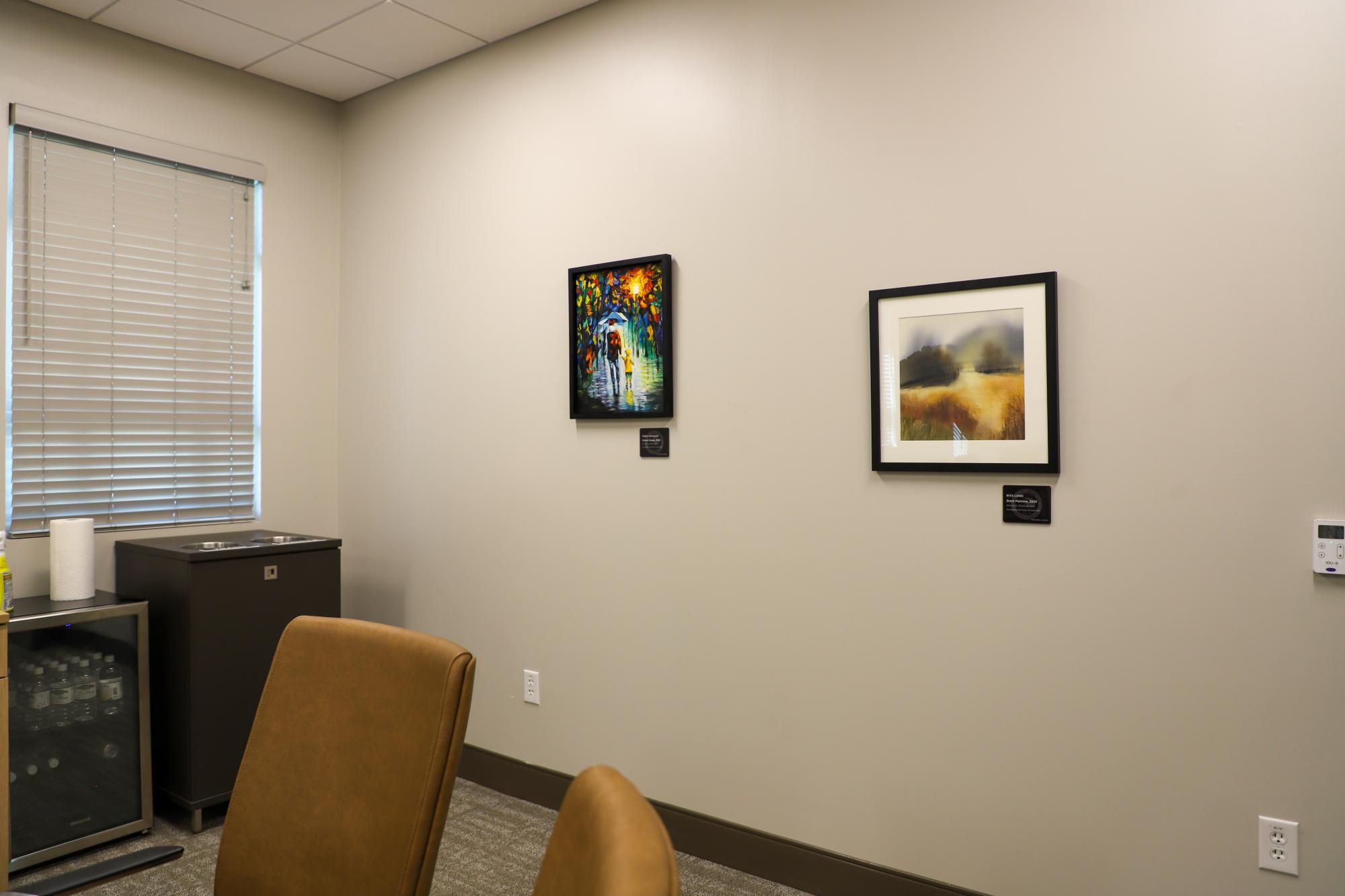 Two paintings hand on a wall of the Mary Alice Warren Community Center