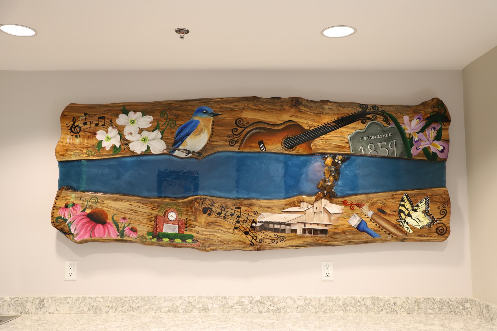 The Beginnings mural at the Mary Alice Warren Community Center depicts Lewisville's charming history.