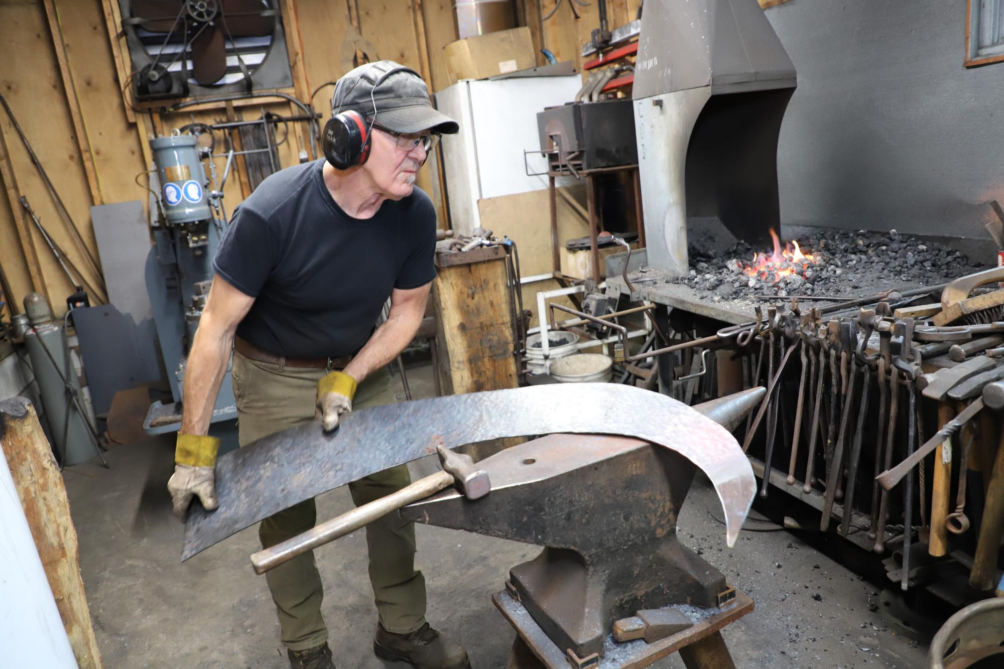 Paul Spainhour works in his studio to create the new sculpture